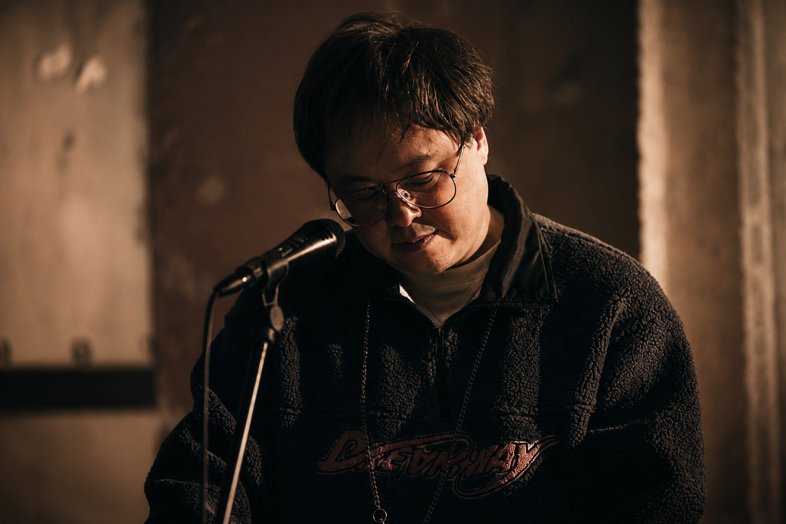 Ryui working at a microphone